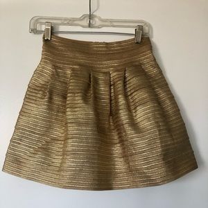 Pleated gold skirt
